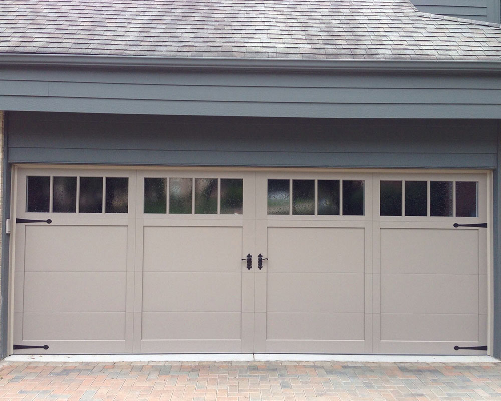 tan garage door on home belle mo